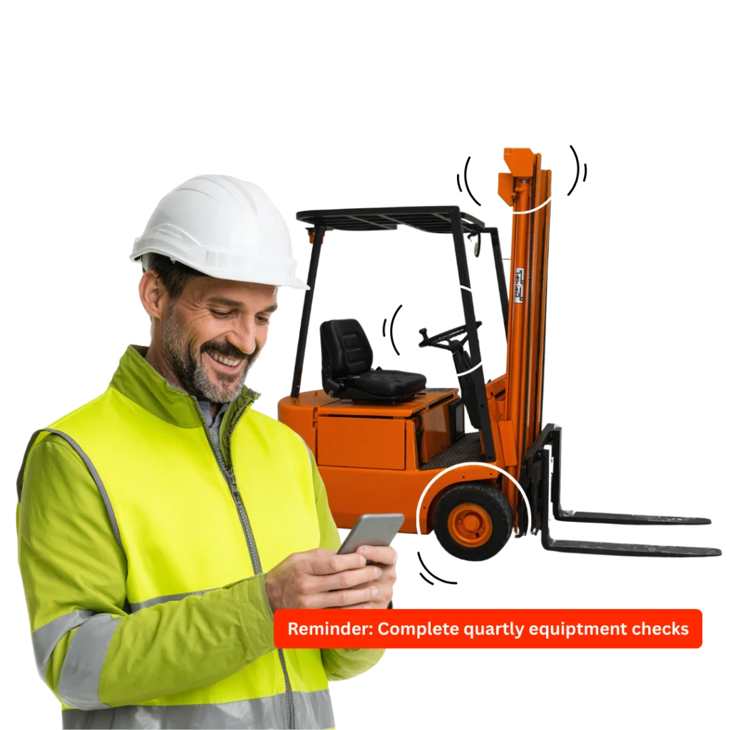 Worker checking his phone beside a forklift truck, with a reminder to complete quarterly equipment checks